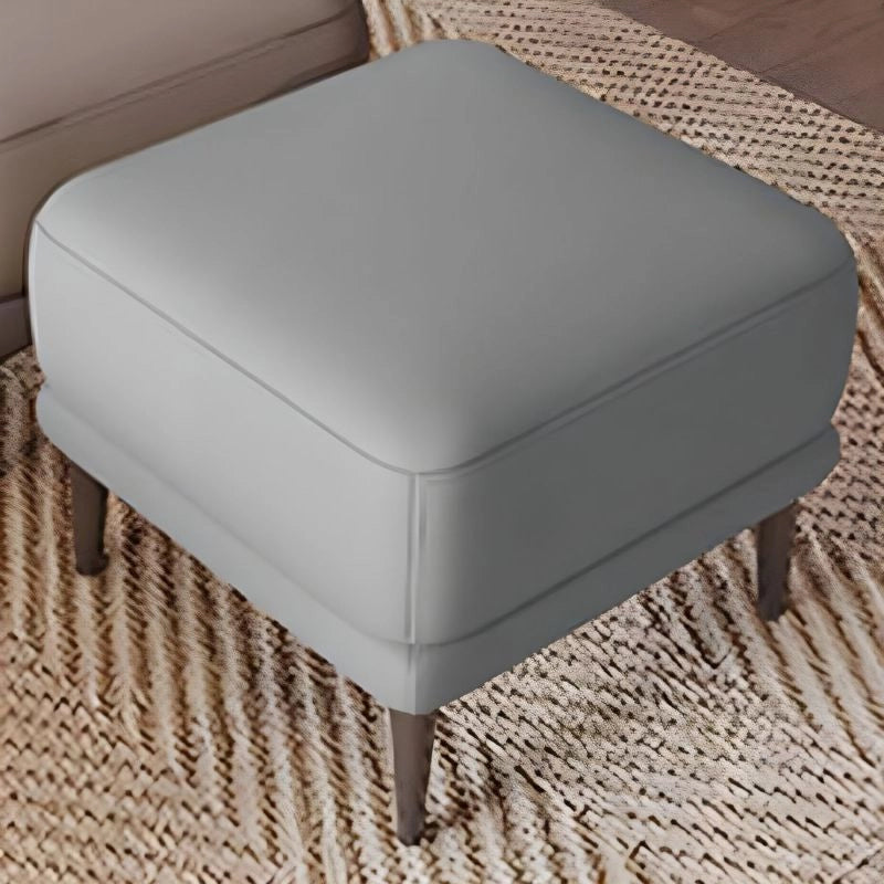 Tapered leg ottoman close-up, leather ottoman, footstool, faux leather, minimal design