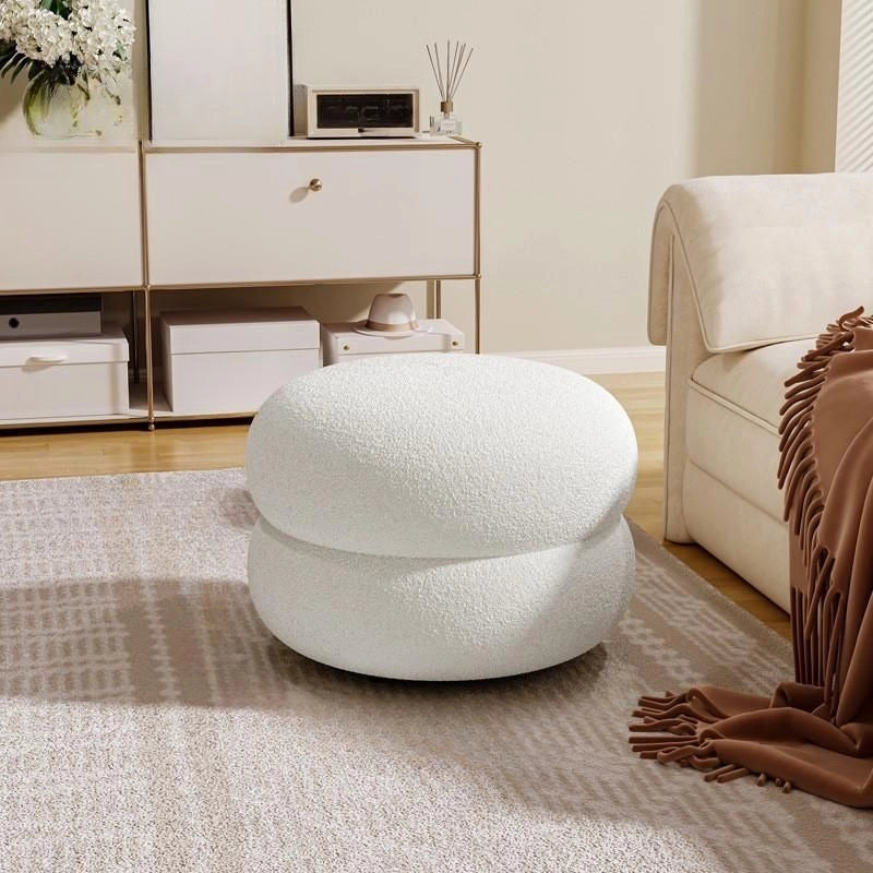 Compact and rounded, it works well as an ottoman seating option, pouf stool, or a low-profile pouffe chair for versatile use.
