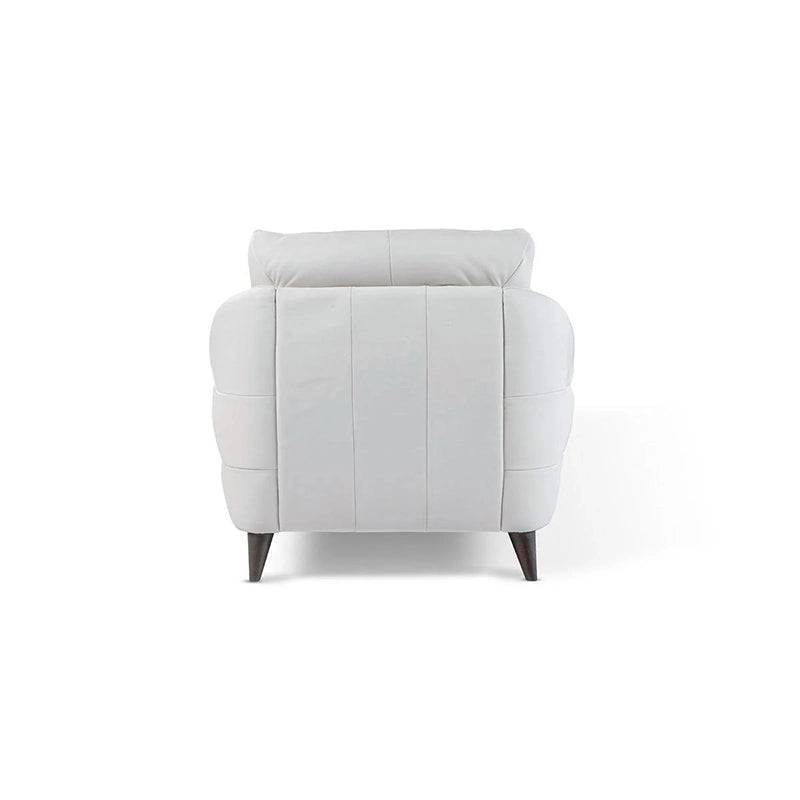  The modern silhouette, paired with tapered legs and ergonomic cushioning, makes it a standout choice for refined interiors.