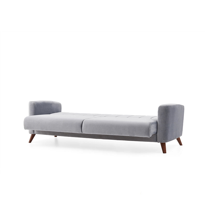  The vertical channel tufting and fixed medium-firm cushions offer both ergonomic support and understated elegance