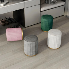 This compact cylindrical pouffe blends stylish ottoman seating with practical comfort.