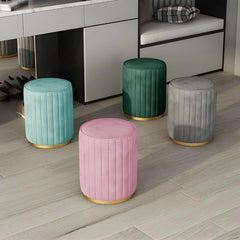 Built with neem wood and 32-density foam, it features a flat, cushioned top upholstered in velvet, supported by a gold-finish base